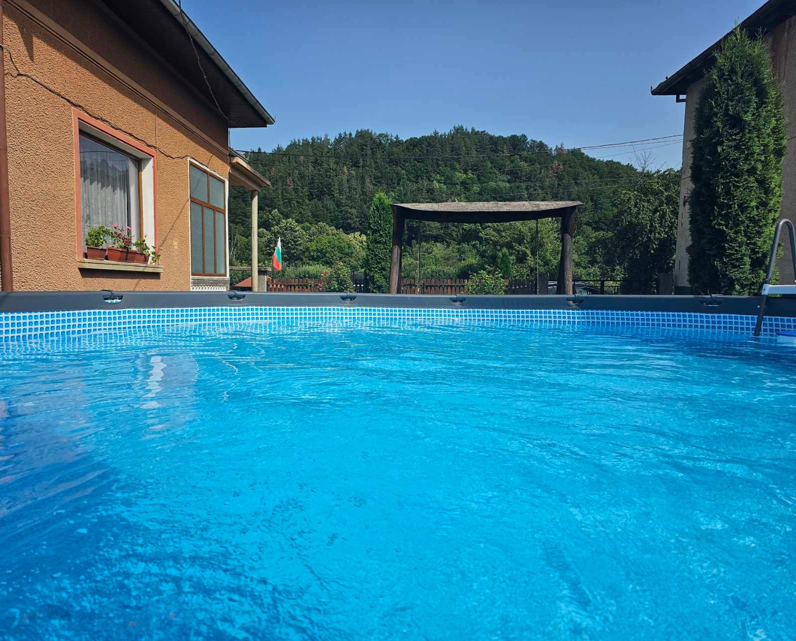 The big pool in the garden of the house.