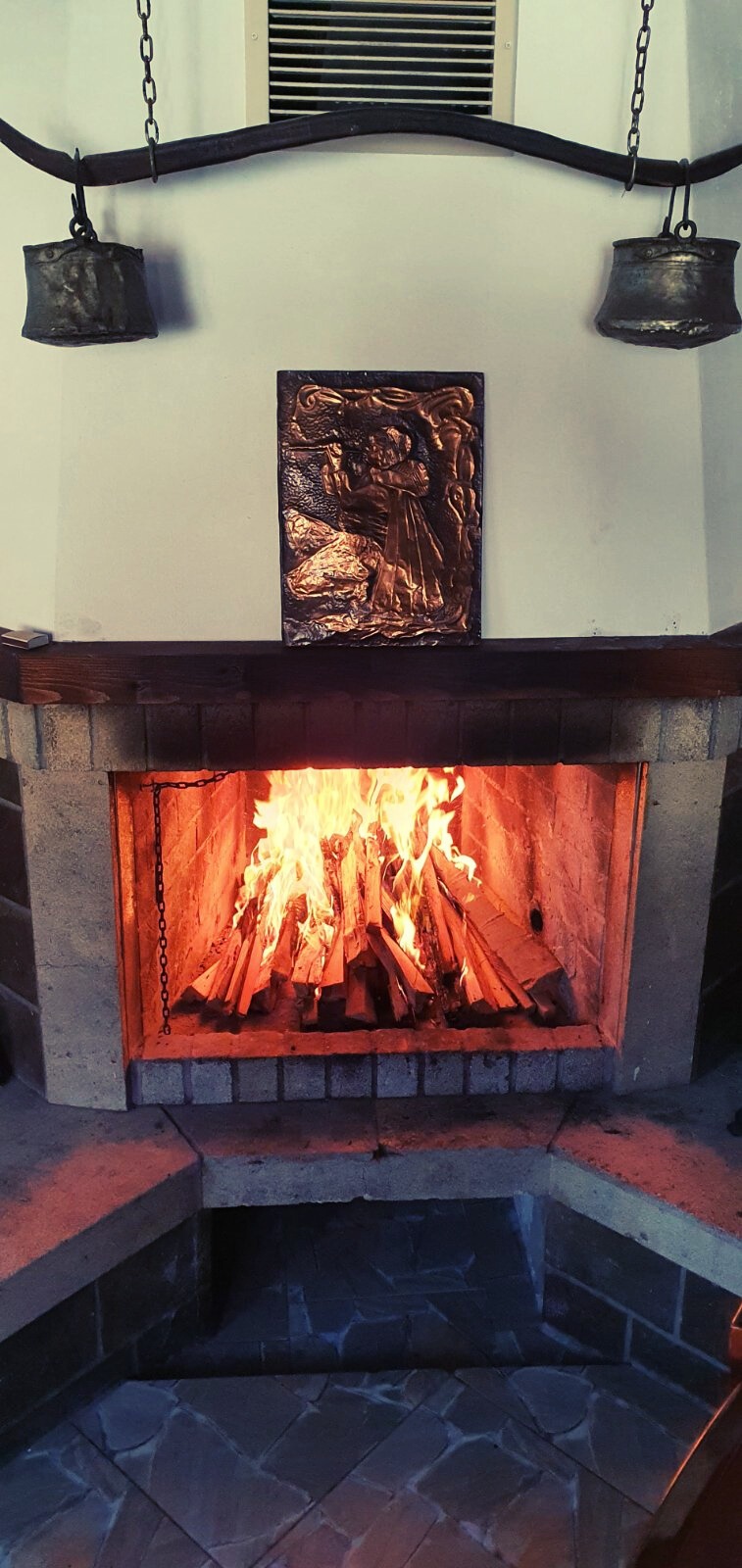 The fireplace in the house's tavern